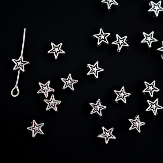 Tiny silver-tone metal beads shaped like five pointed stars, 6mmx6mm