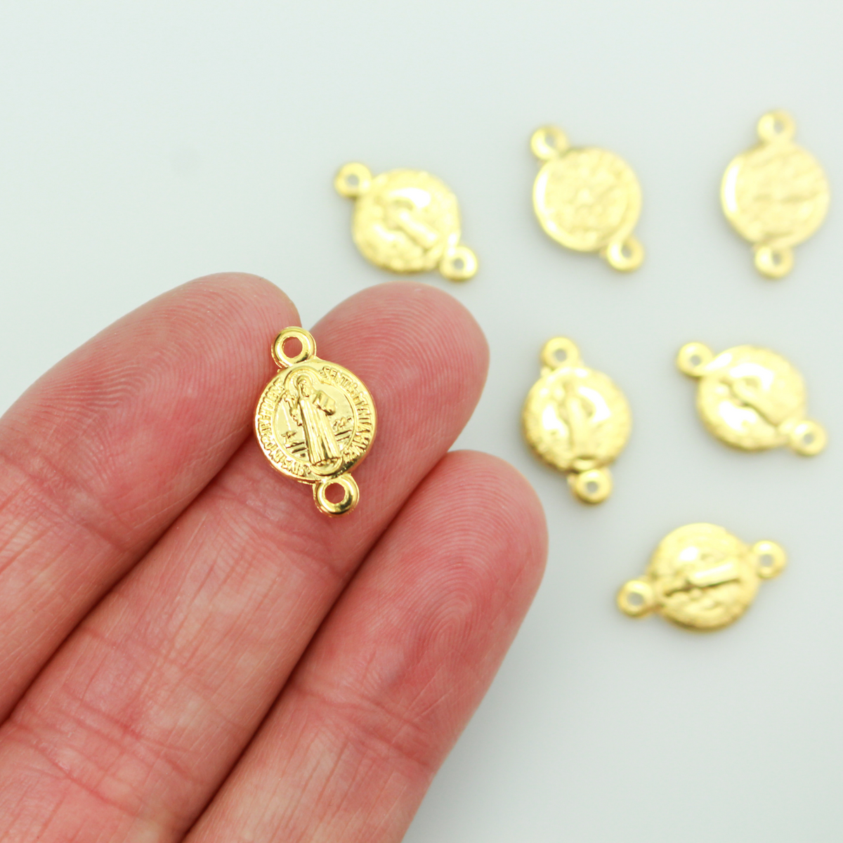 Saint Benedict Medal round flat connector links that are a shiny gold color and are handcrafted in Italy