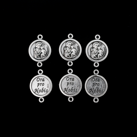 Saint Joseph round flat connector links that are silver oxidized plating on a base metal. The backside is marked "Ora Pro Nobis" in Latin which translates to pray for us