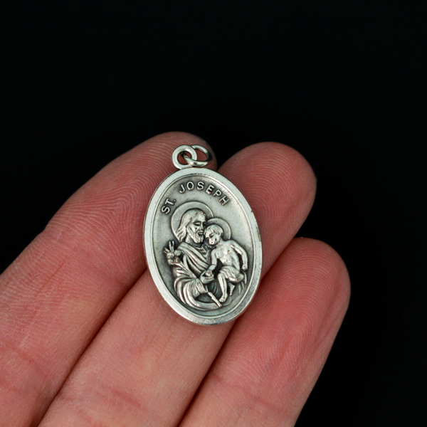 Saint Joseph oval medal that depicts the saint on the front and "Pray For Us" on the back