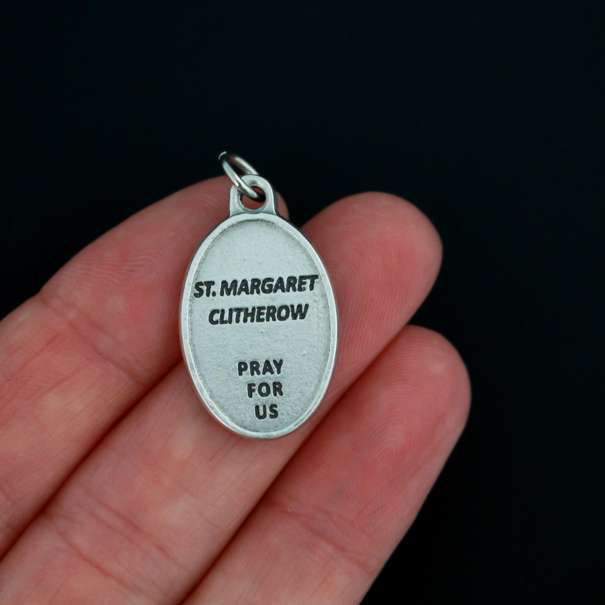 Saint Margaret Clitherow medal that depicts the saint on the front and is marked "Pray For Us" on the back