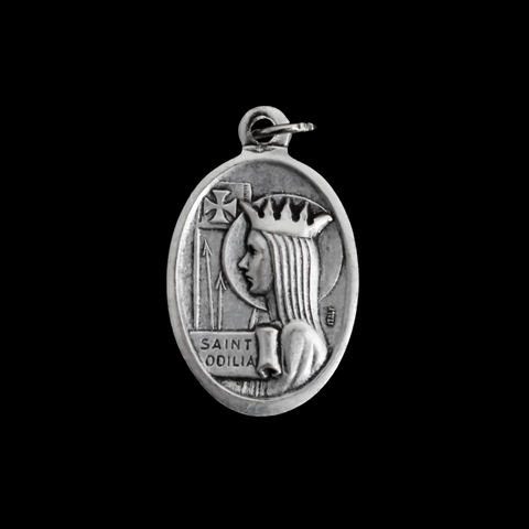 Saint Odilia medal that depicts the saint on the front and is marked "Pray For Us" on the back