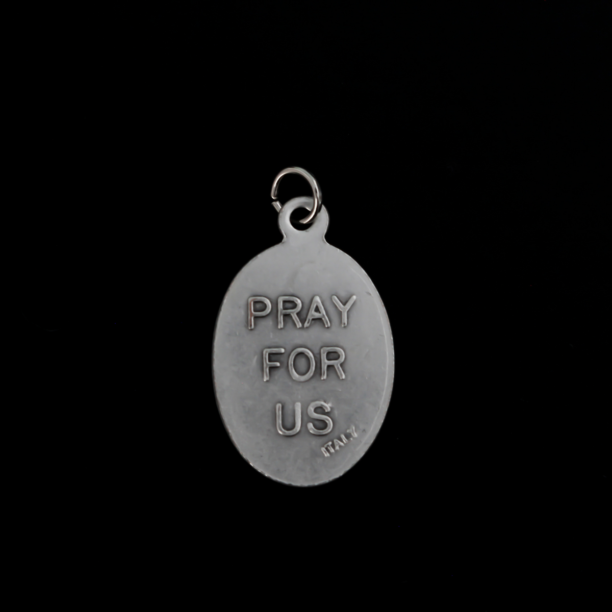 Holy Mother Saint Scholastica medal that depicts the saint on the front and is marked "Pray For Us" on the back
