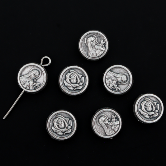 St. Therese of Lisieux metal beads with a rose on the backside. These round, flat beads are silver oxidized base metal and are handcrafted in Italy