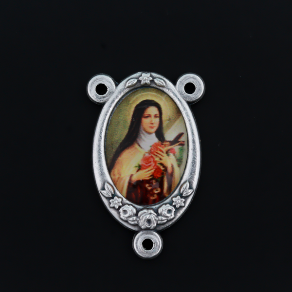 Rosary center that has a color image of Saint Therese of Lisieux inlaid in a silver oxidized Center with a flower detail on the edge