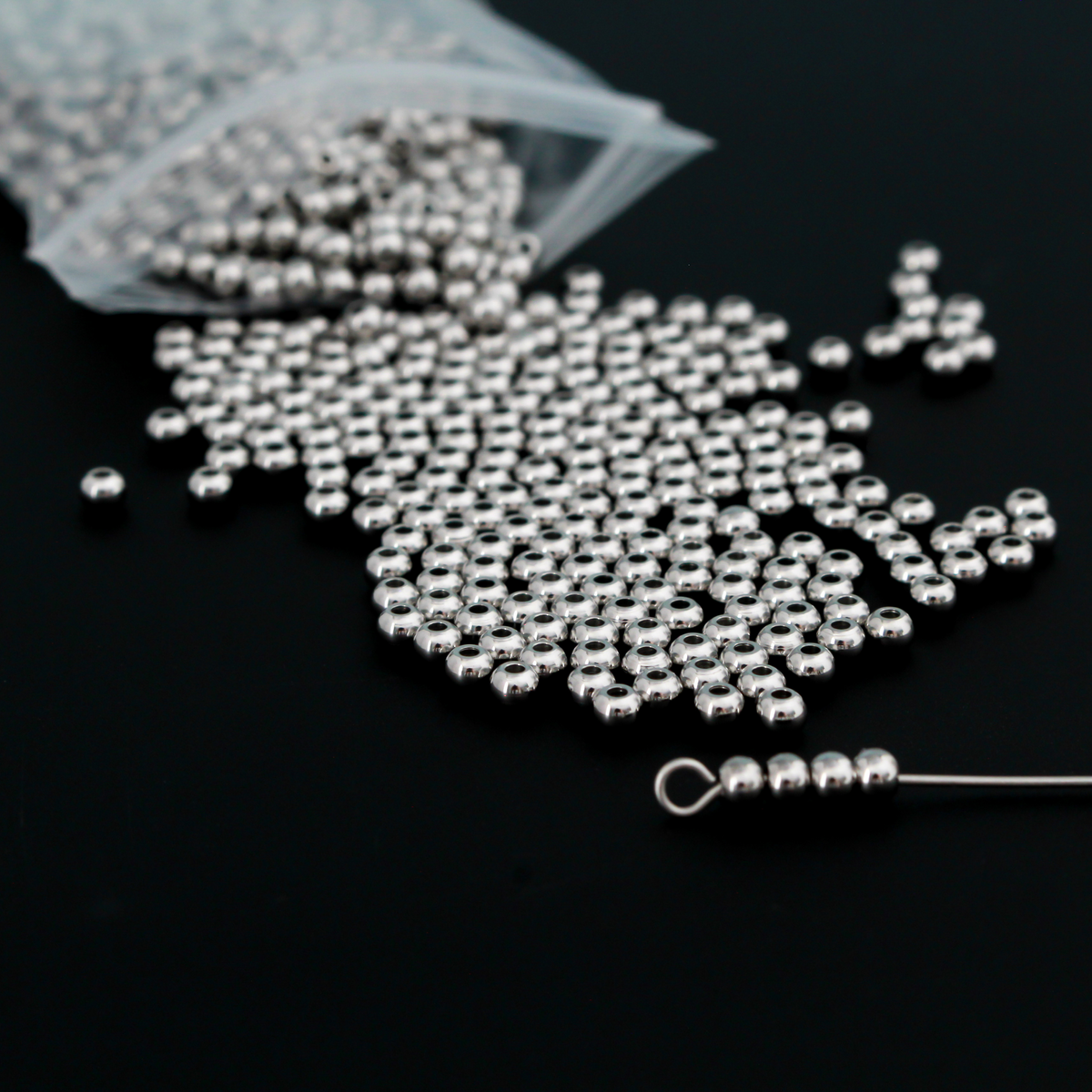 201 stainless steel spacer beads that are 3mm round with a polished seamless surface