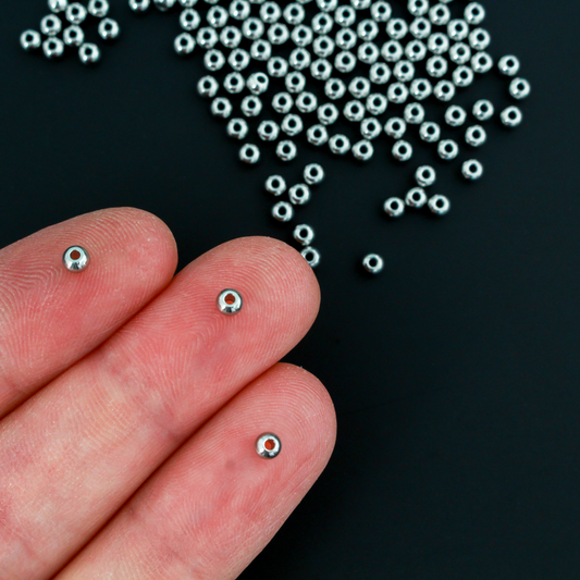 201 stainless steel spacer beads that are 3mm round with a polished seamless surface