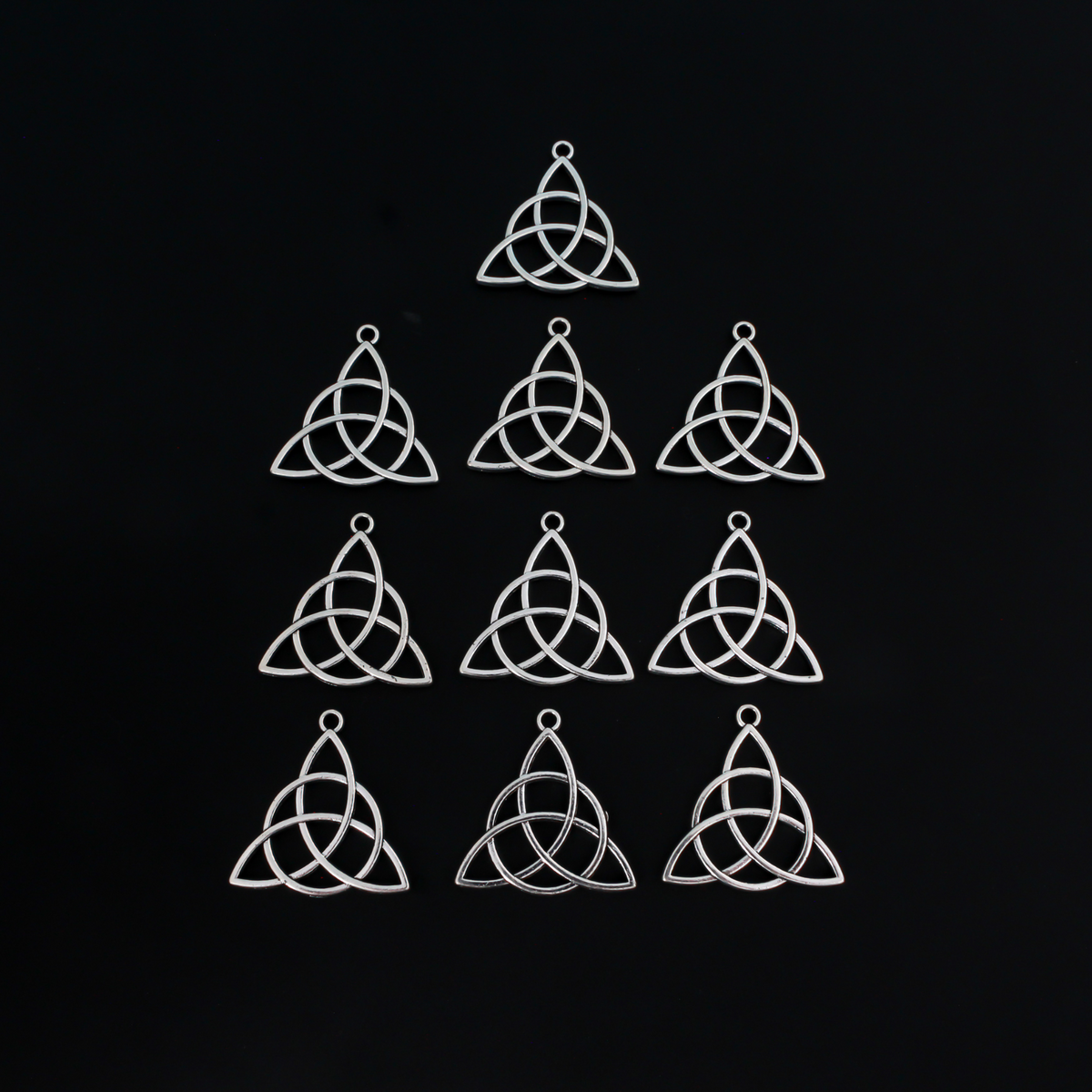 Celtic knot charms that are an antiqued silver tone color, 28.5mm long