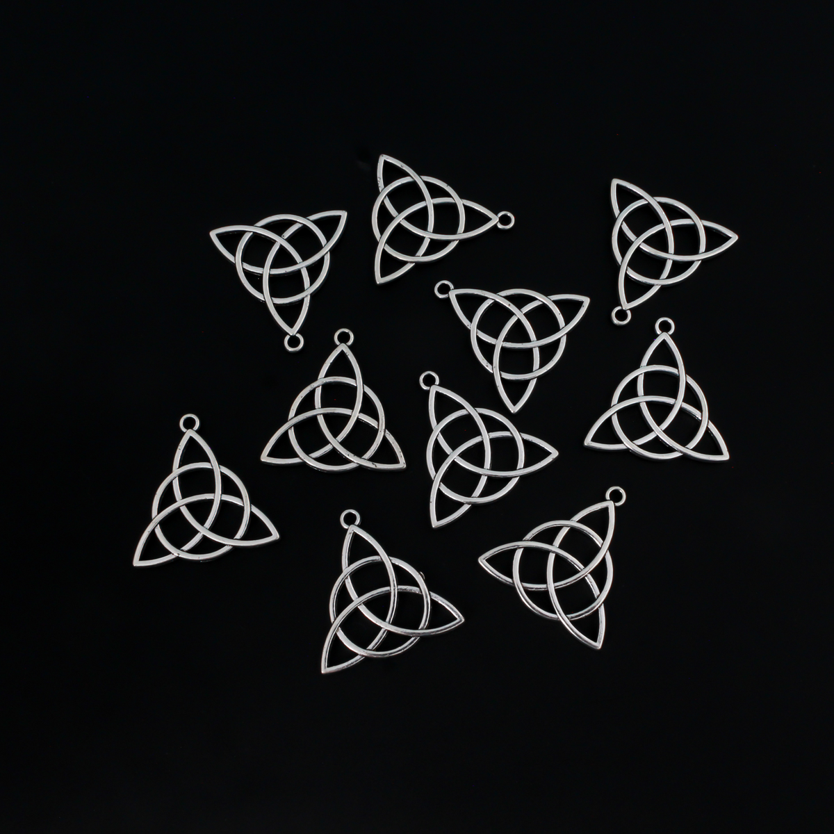 Celtic knot charms that are an antiqued silver tone color, 28.5mm long