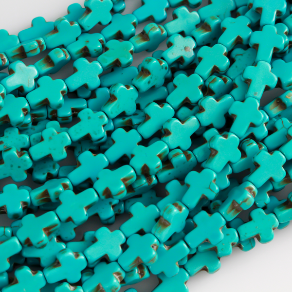 Turquoise cross shaped beads that are a synthetic turquoise material, 10x8x3mm