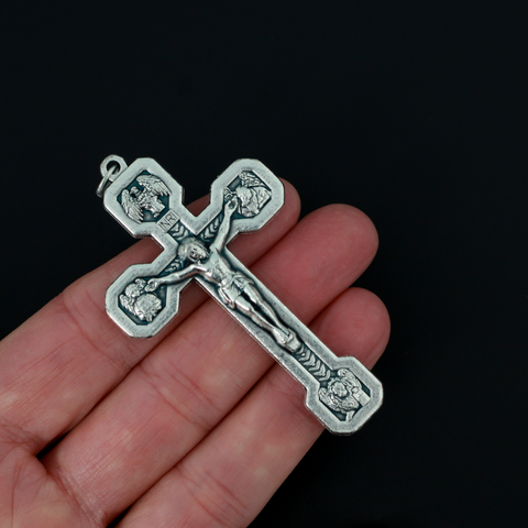 Large Via Crucis crucifix pendant. Surrounding the corpus of Christ on this the cross are images of the four authors of the Gospels - Matthew, Mark, Luke and John