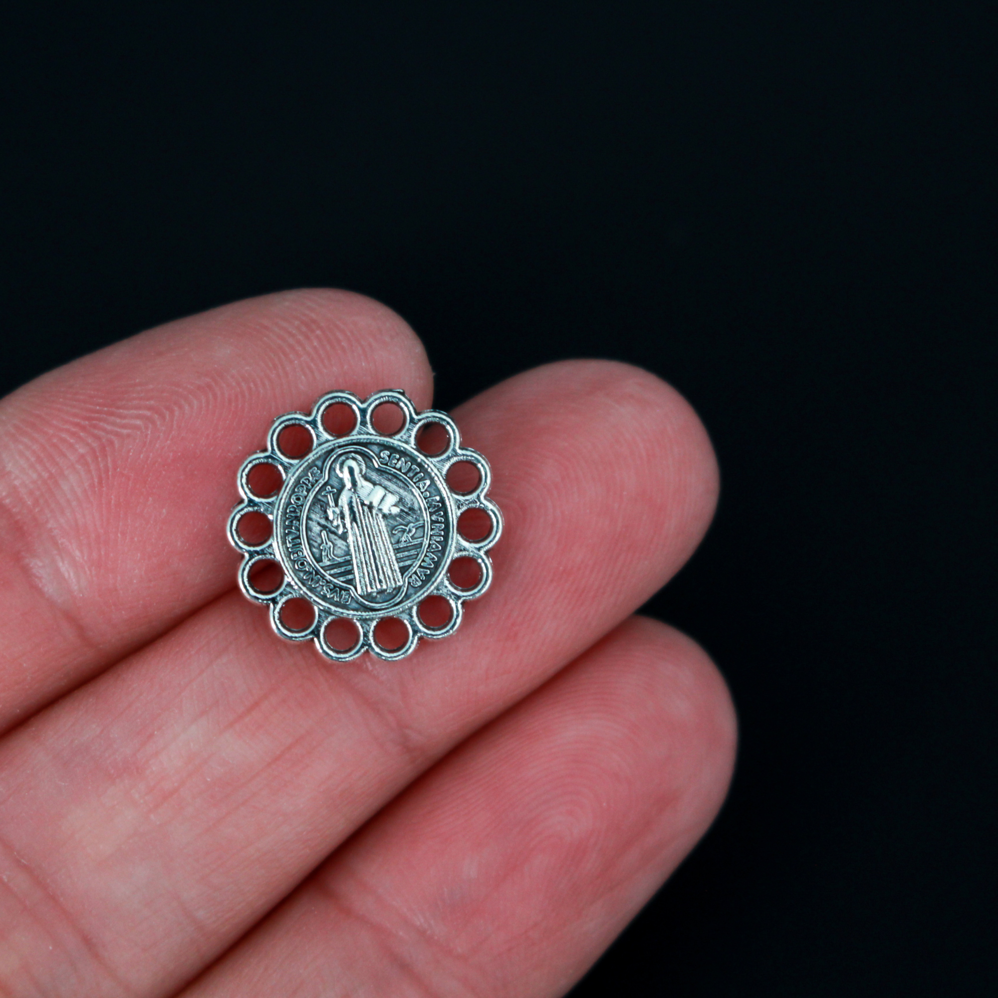 15mm St. Benedict charms. The edge of the charm is made up of circles so you can use this as a charm, a rosary centerpiece, bracelet links, etc