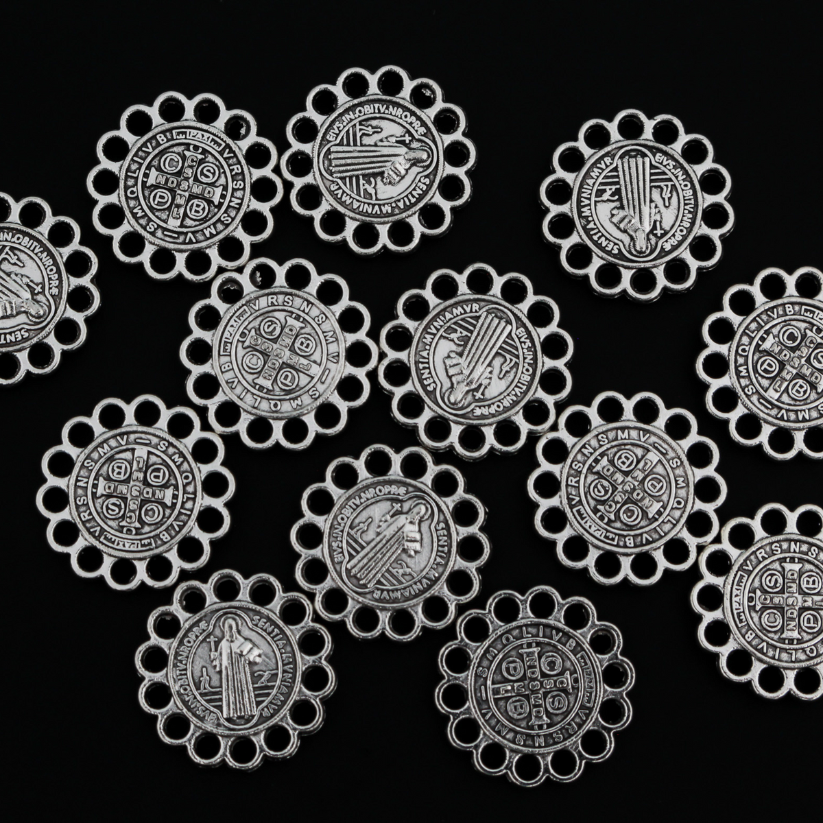 15mm St. Benedict charms. The edge of the charm is made up of circles so you can use this as a charm, a rosary centerpiece, bracelet links, etc