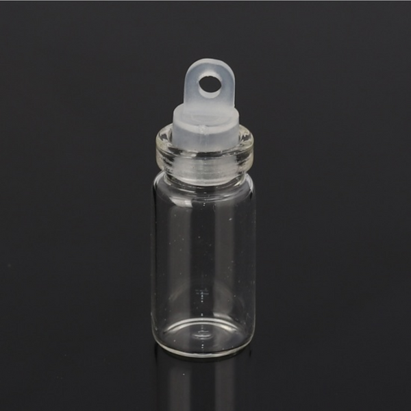 small glass bottle with a plastic stopper that has a bail hole so you can easily attach a jump ring (not included)