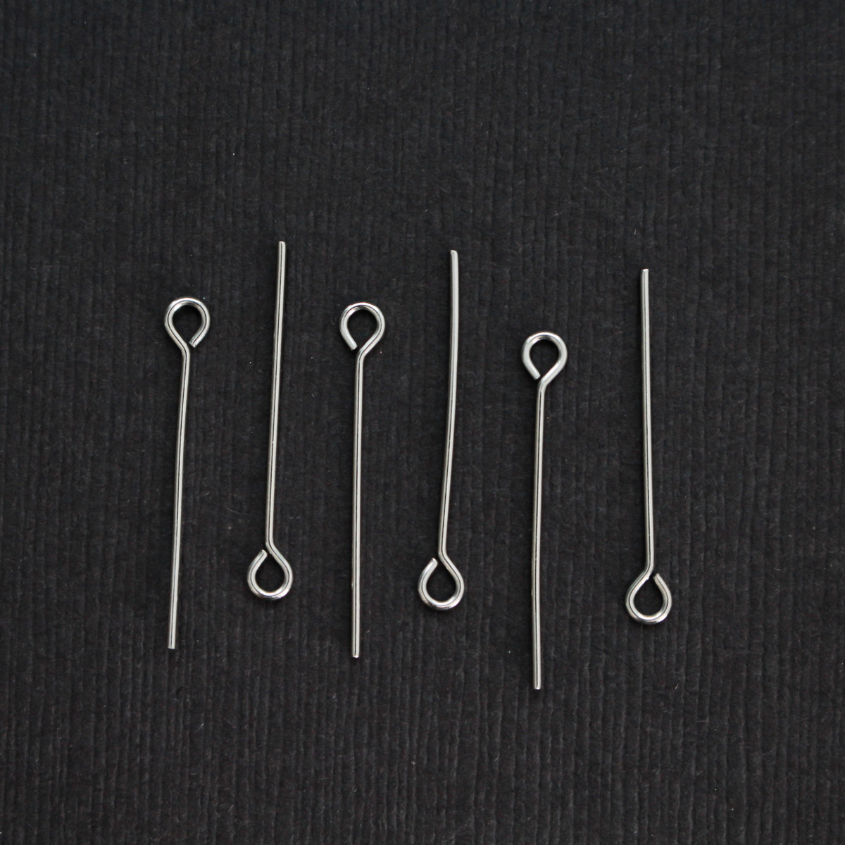 Solid stainless steel eye pins that are 25mm long