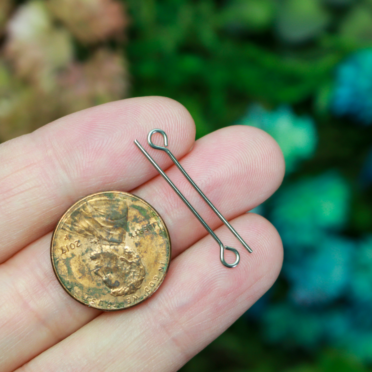 Solid stainless steel eye pins that are 25mm long