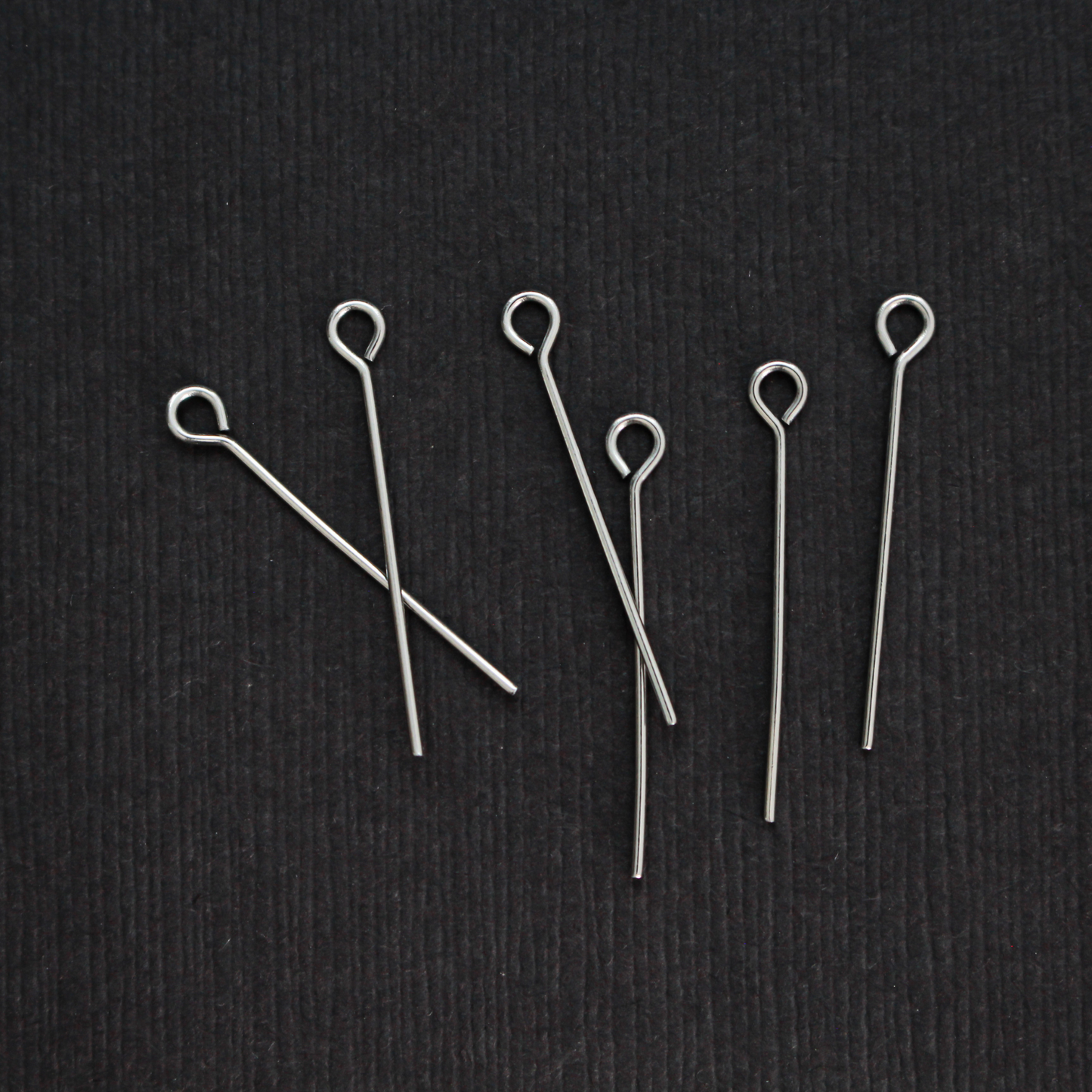 Solid stainless steel eye pins that are 25mm long