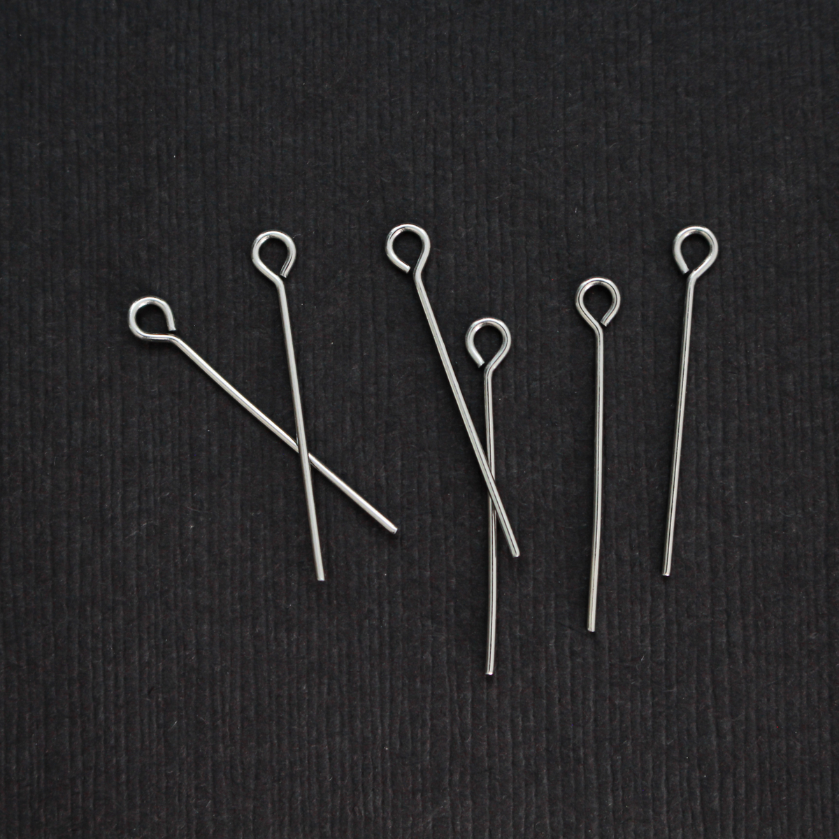 Solid stainless steel eye pins that are 25mm long