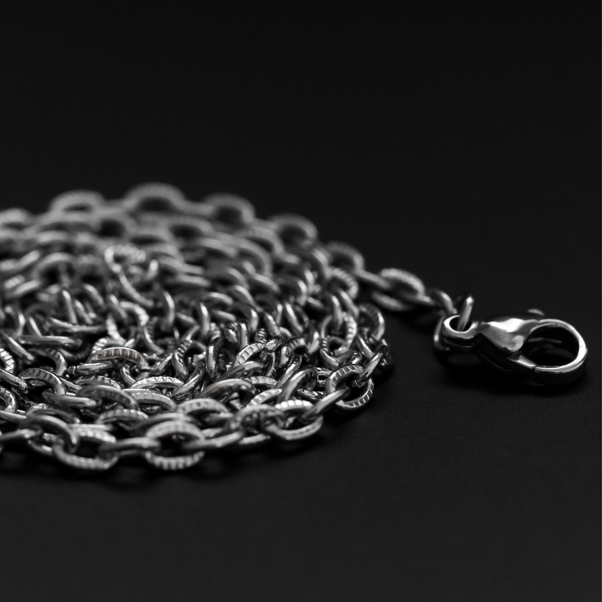 Stainless steel cable necklace chain with textured links and a lobster claw clasp, 50cm long