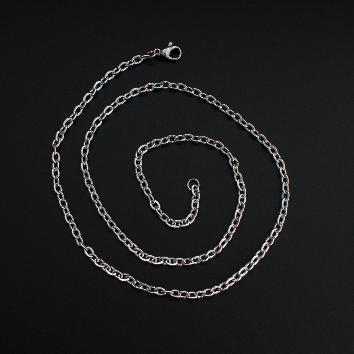 Stainless steel cable necklace chain with textured links and a lobster claw clasp, 50cm long
