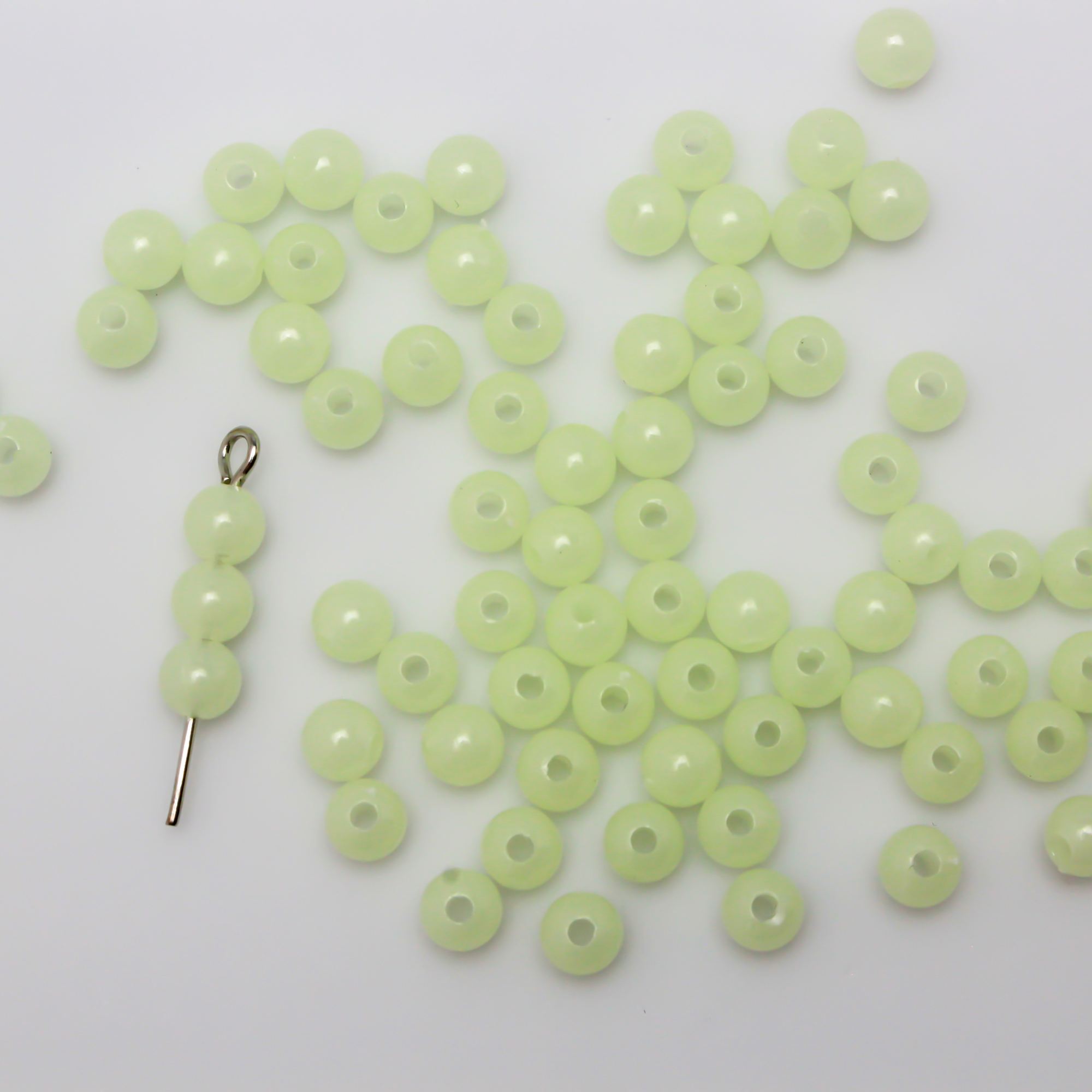 Luminous glow in the dark acrylic beads that are center drilled. They are a light pale green color when viewed in daylight. They glow green in the dark