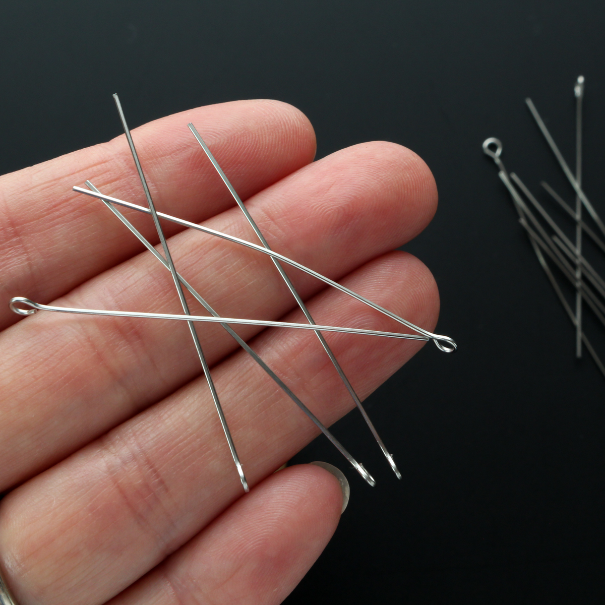 Solid stainless steel eye pins that are 50mm long