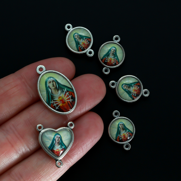 The Five Holy Wounds of Christ devotional chaplet set. This set consists of six medals in total that are two sided color imaged pieces