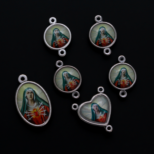 The Five Holy Wounds of Christ devotional chaplet set. This set consists of six medals in total that are two sided color imaged pieces