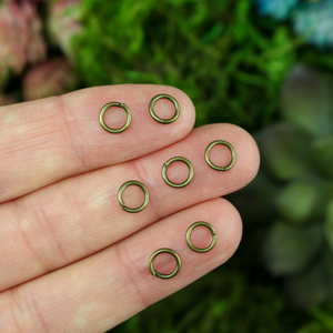 6mm round bronze colored jump rings sold in packs of 100