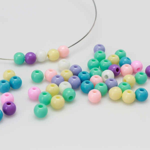 6mm round opaque beads in a random mix of pastel colors.