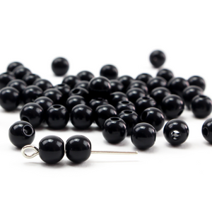 6mm round black beads that have a 1.5mm hole center drilled