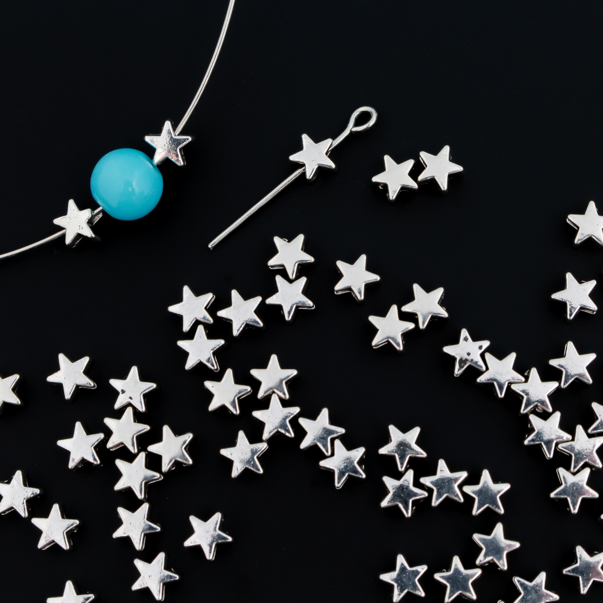 Tiny silver-tone metal beads shaped like five pointed stars, perfect for rosaries, chaplets, bracelets. 6mmx6mm