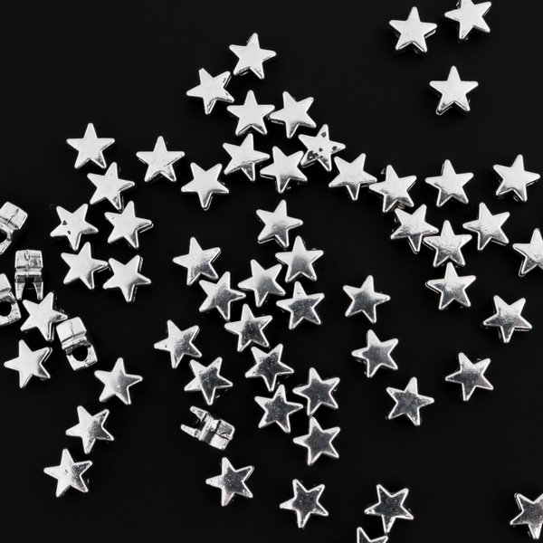 Tiny silver-tone metal beads shaped like five pointed stars, perfect for rosaries, chaplets, bracelets. 6mmx6mm