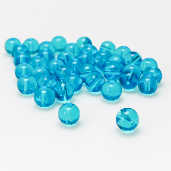 8mm round glass beads in a transparent aquamarine blue color.
