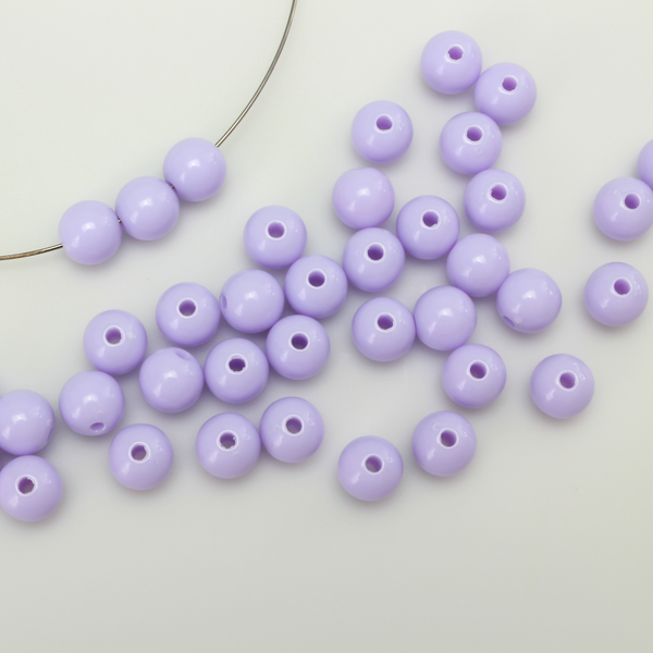 Round pale purple opaque beads that are 8mm in diameter with a 1.5mm hole size. 