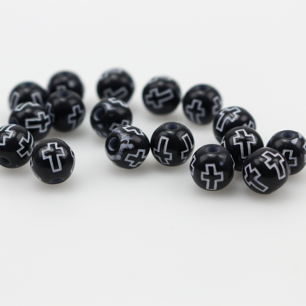 Black acrylic beads with a white etched cross design. The beads are 8mm round with a 2mm hole size.