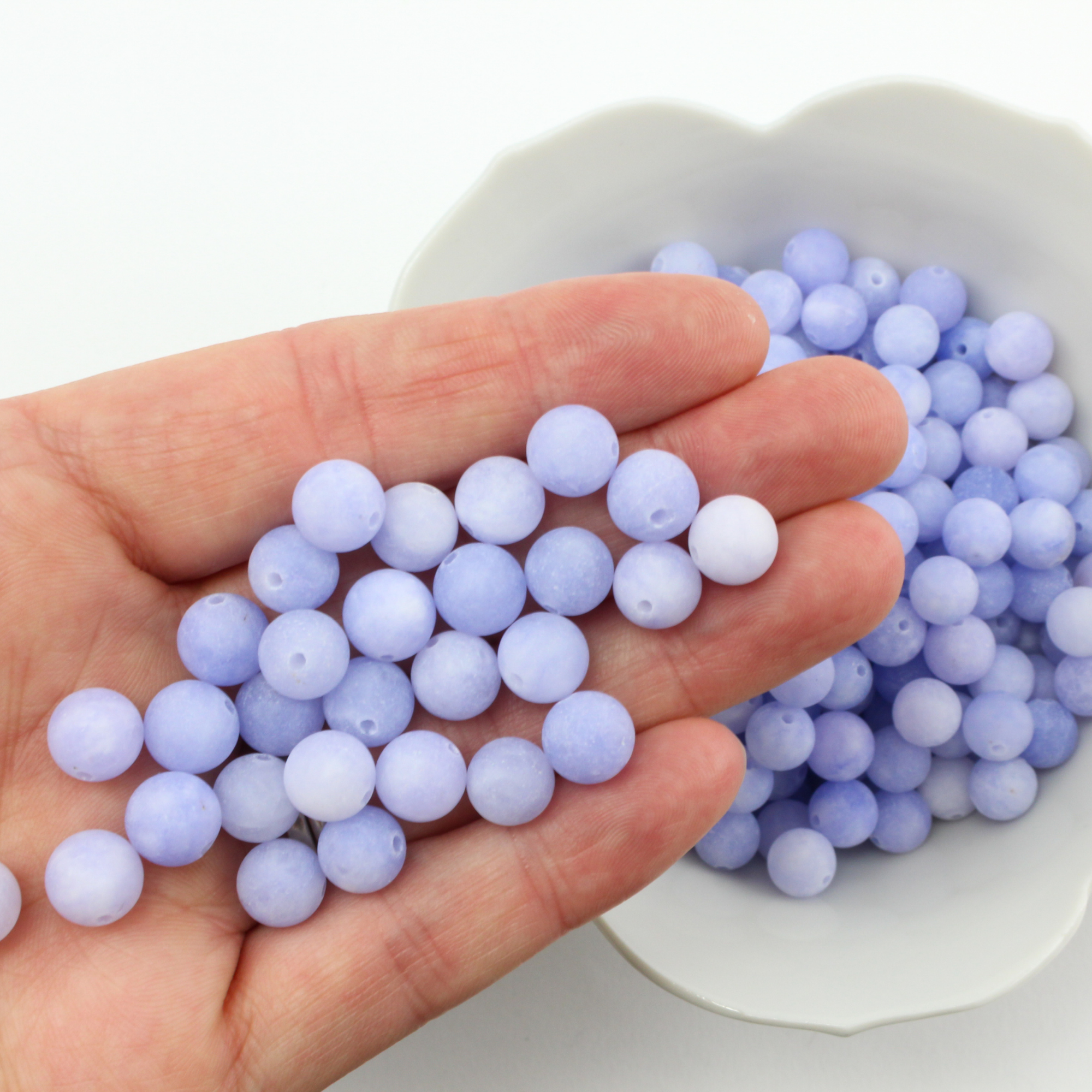 60 loose beads, natural white jade that are dyed/frosted a cornflower blue color. They are 8mm round with a 1mm hole size.