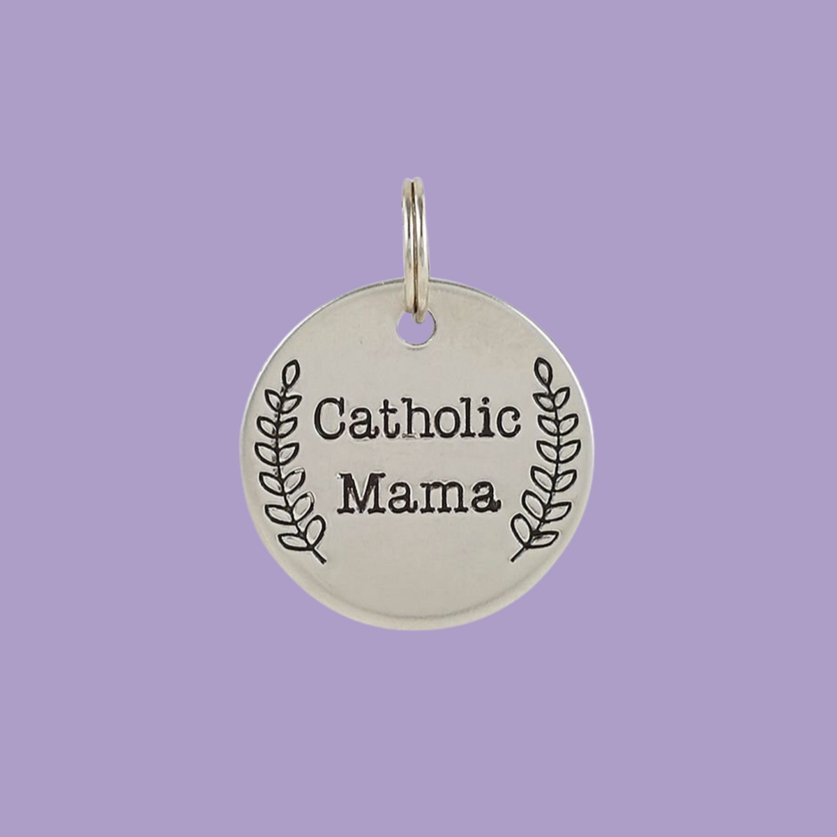 Stainless steel one inch round charm engraved with "Catholic Mama".