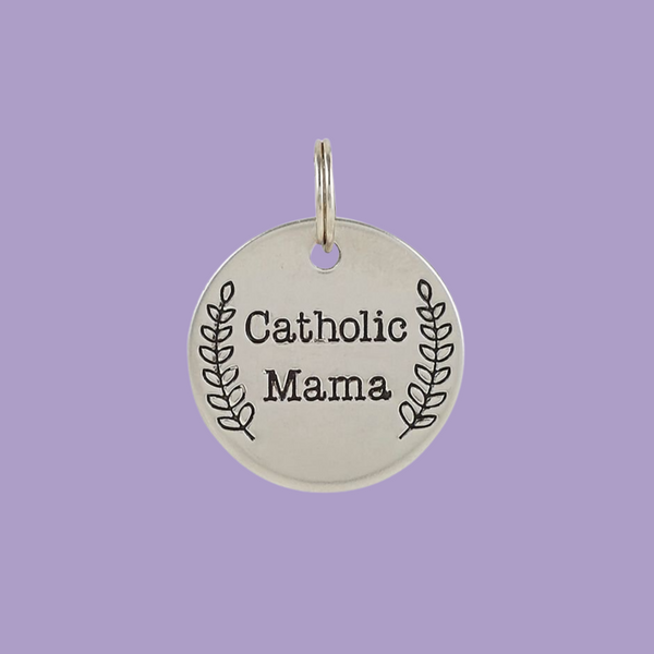 Stainless steel one inch round charm engraved with "Catholic Mama".