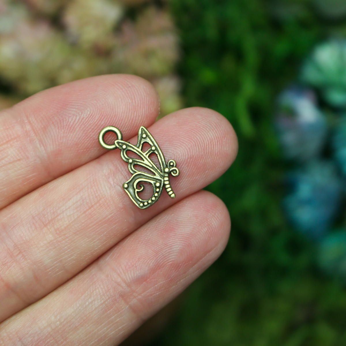 Butterfly charms in an antiqued bronze finish, 16mm long