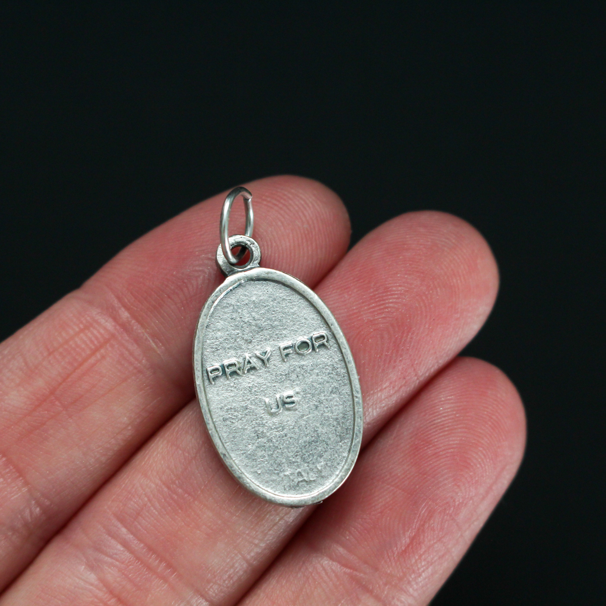 Saints Cosmas and Damian oval medal that depicts the brothers on the front and "Pray For Us" on the back