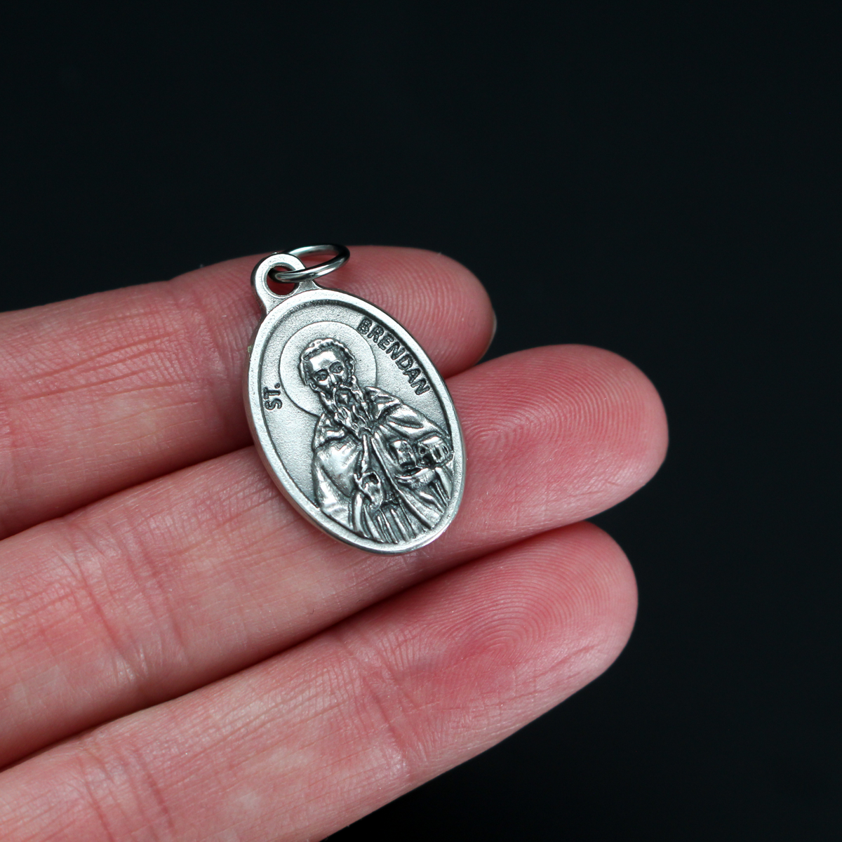 Saint Brendan of Clonfert medal that depicts the saint on the front and "Pray For Us" on the back