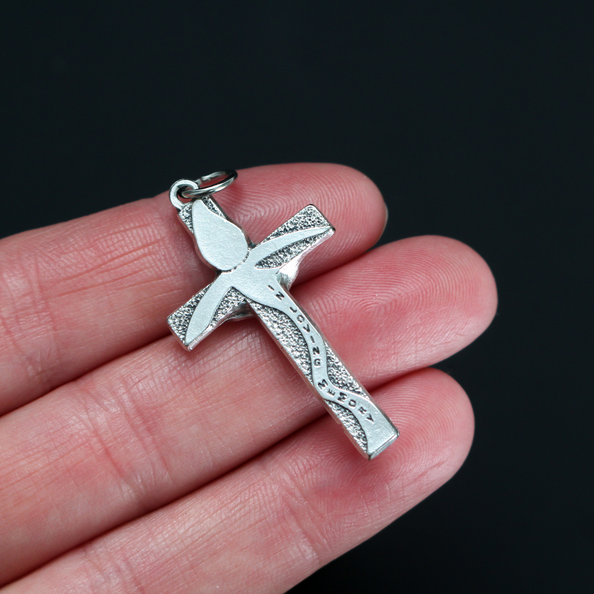 Memorial crucifix cross with a teardrop above Jesus and on the words "In Loving Memory" on the cross beam. The reverse side also is marked "In Loving Memory"