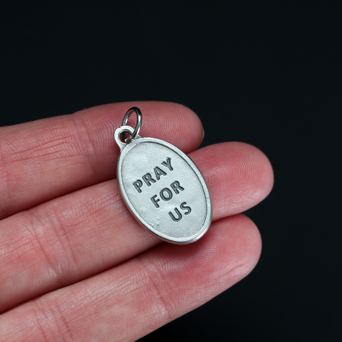 Saint Brendan of Clonfert medal that depicts the saint on the front and "Pray For Us" on the back