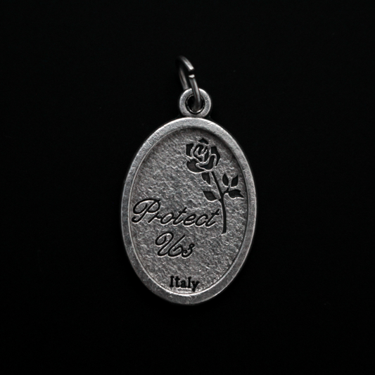 Archangel Michael oval medal. The front depicts St. Michael, the warrior angel of protection and the reverse is marked "Protect Us".