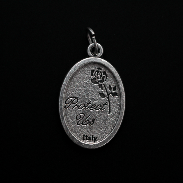 Archangel Michael oval medal. The front depicts St. Michael, the warrior angel of protection and the reverse is marked "Protect Us".