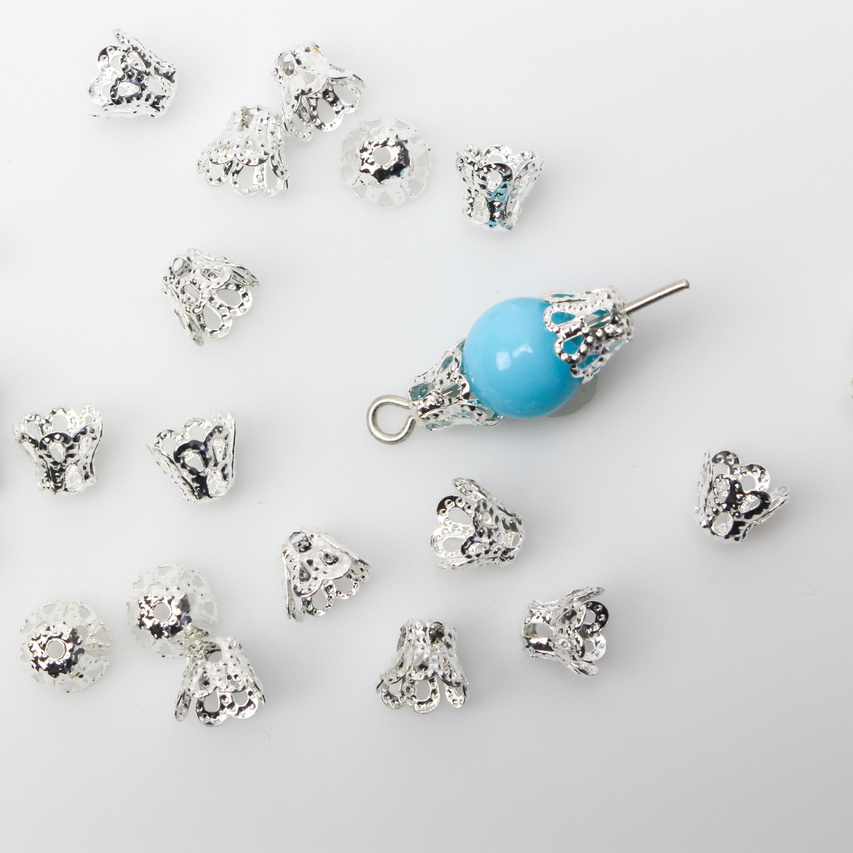 Filigree bead cap cups that are 5mm long by 6mm in diameter at the opening. They can fit beads 6mm - 8mm