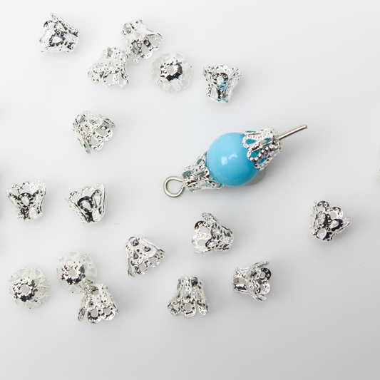 Filigree bead cap cups that are 5mm long by 6mm in diameter at the opening. They can fit beads 6mm - 8mm
