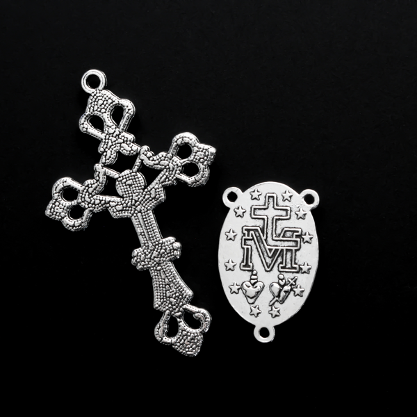 Silver-tone rosary set that includes a Virgin Mary centerpiece and an ornate crucifix cross.