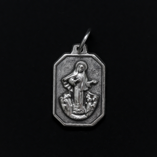 Unique shaped medal with Our Lady of Medjugorje on the front and St. James Church on the back.